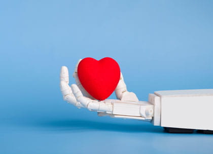 Robot hand holding heart